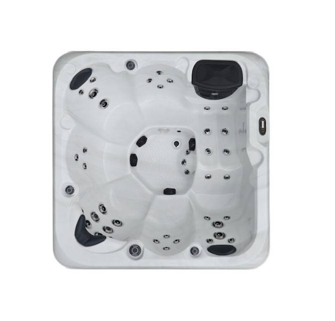 Spa blanc carré moderne vue de dessus, avec 6 places assises, de nombreux jets d'hydromassage et des appuie-têtes noirs.